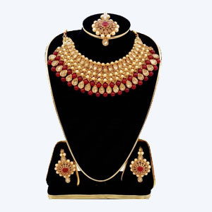 Regal Crimson & Gold Kundan Jewelry Set  includes a statement choker matching drop earrings, and a coordinated maang tikka.